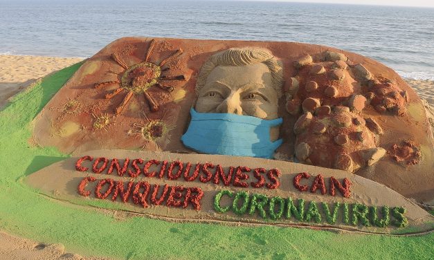 Coronavirus in  sand art on Puri beach